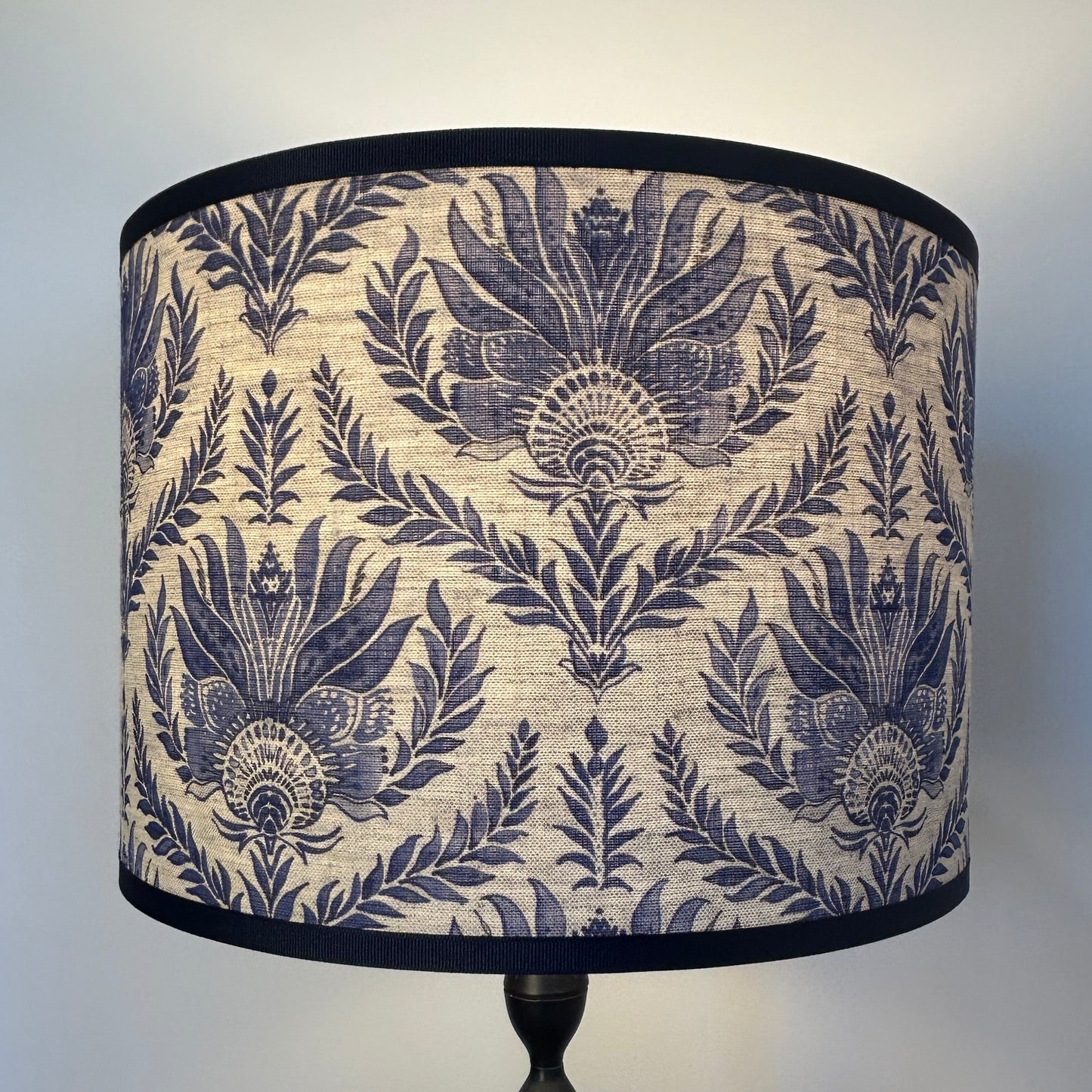 Decorative lampshade with blue leaf pattern on natural genuine linen with navy trim