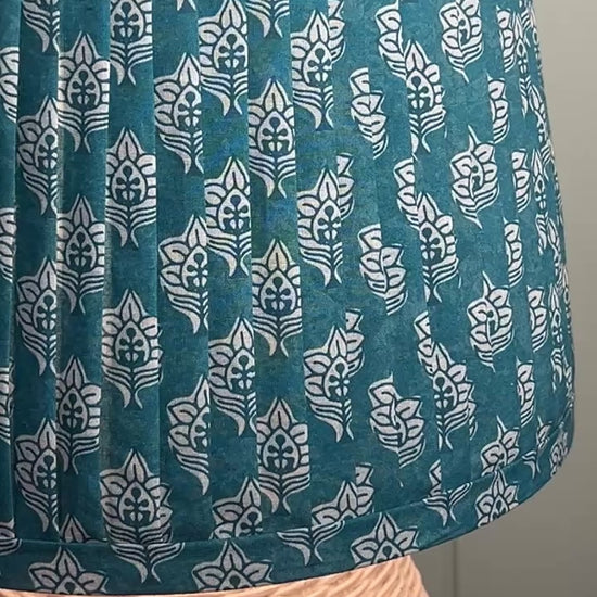 Pleated blue lampshade closeup video